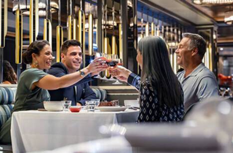 A group of friends cheering their drinks