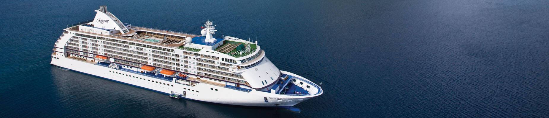 A panoramic image of Seven Seas Voyager at sea in Tahiti