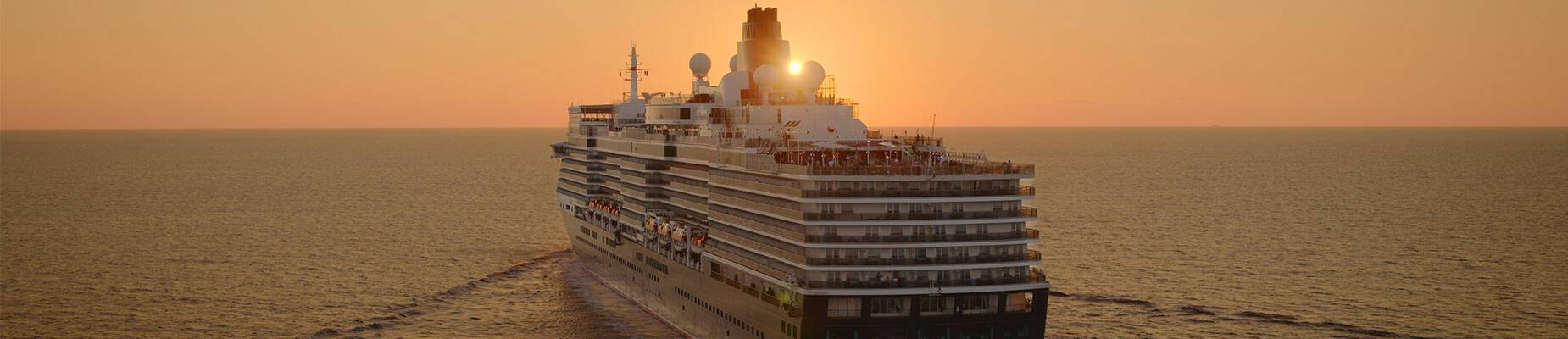 Queen Elizabeth sailing towards the sunset