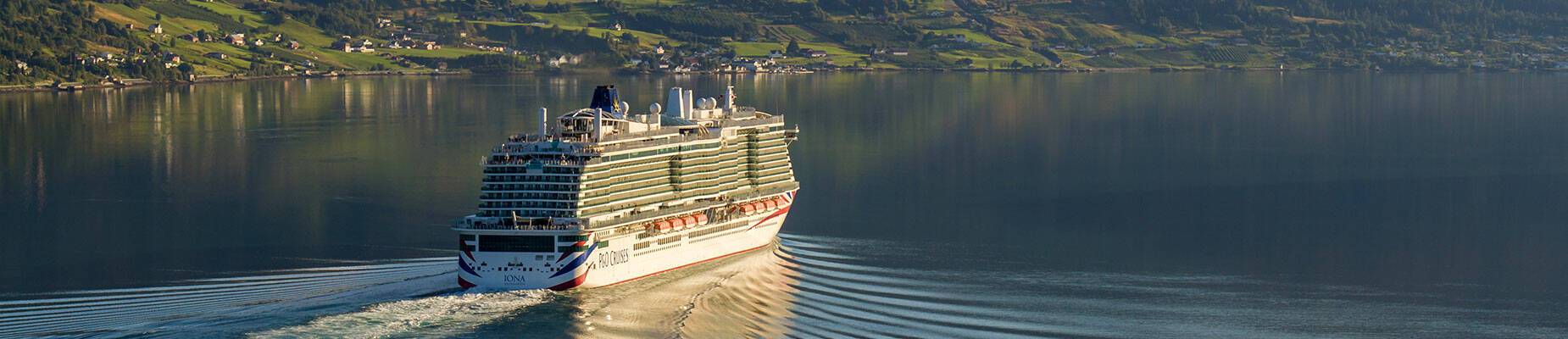 A cruise ship sailing away