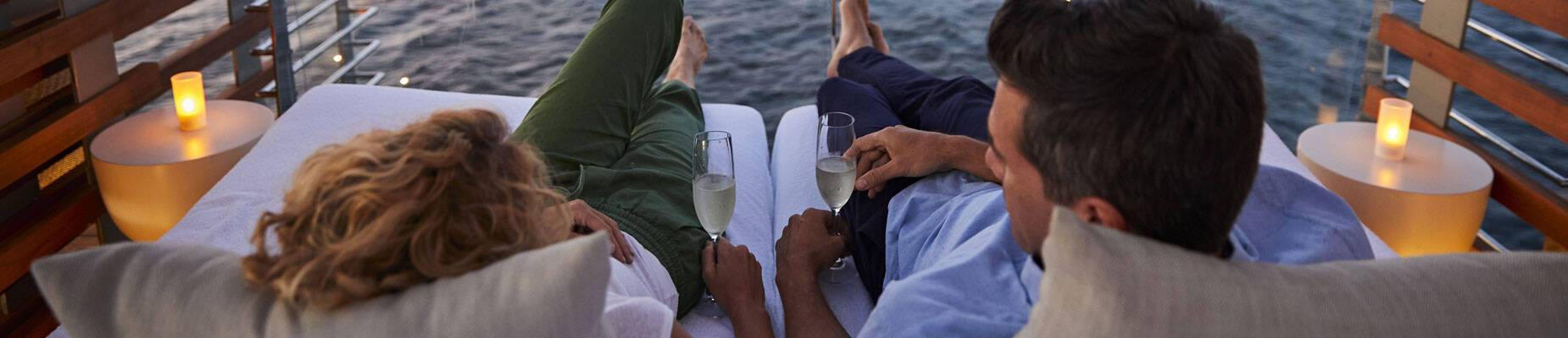 A couple relaxing aboard a Celebrity Cruises ship