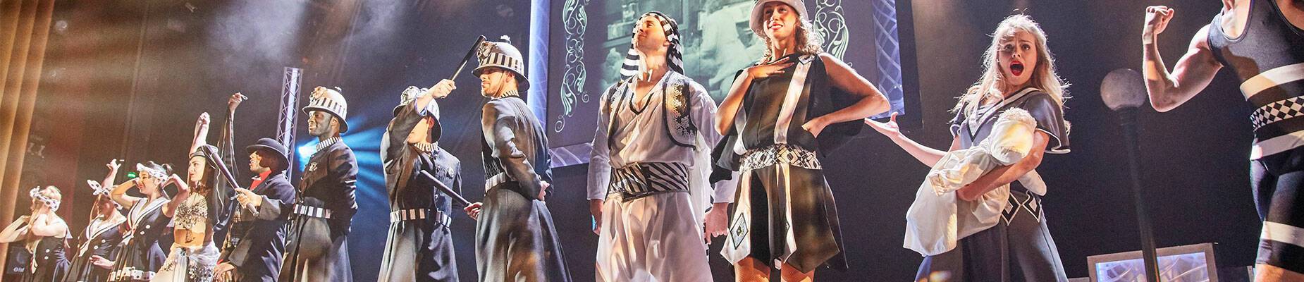 A cast of actors on stage