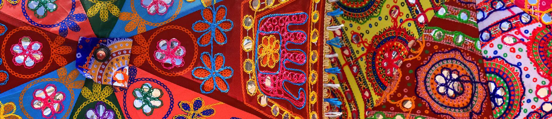 Close-up image of handcrafted colourful umbrellas in India