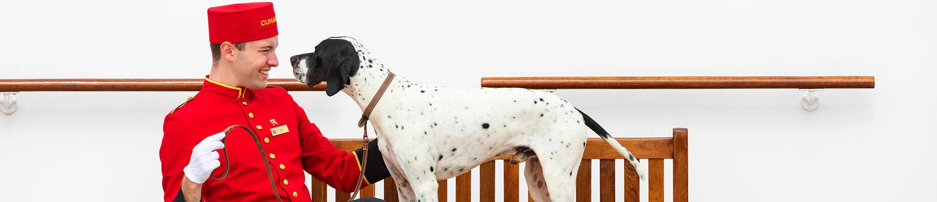 A man and dog sitting on a bench