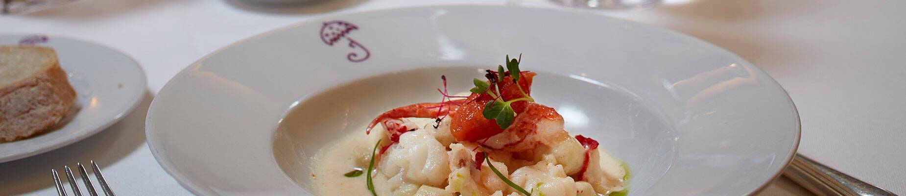 A meal and glass of wine on a table