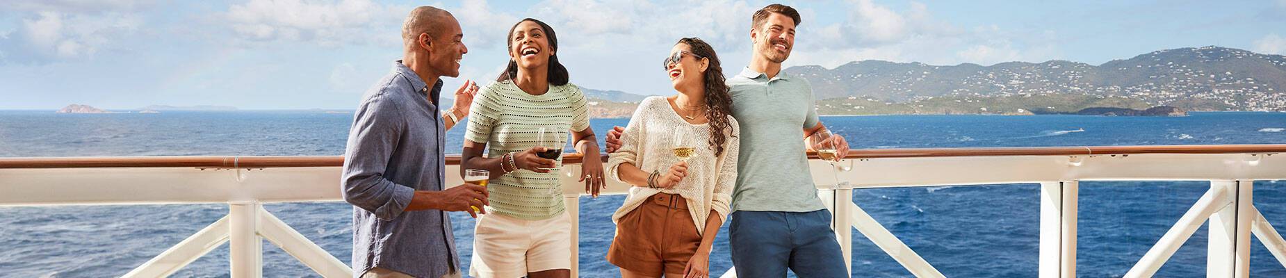 A group of friends standing on a cruise ship deck