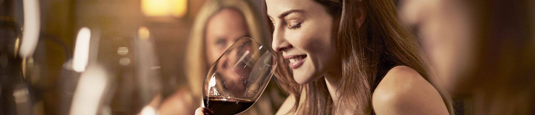 A woman enjoying a glass of wine in Vines Bar on a Princess Cruises voyage