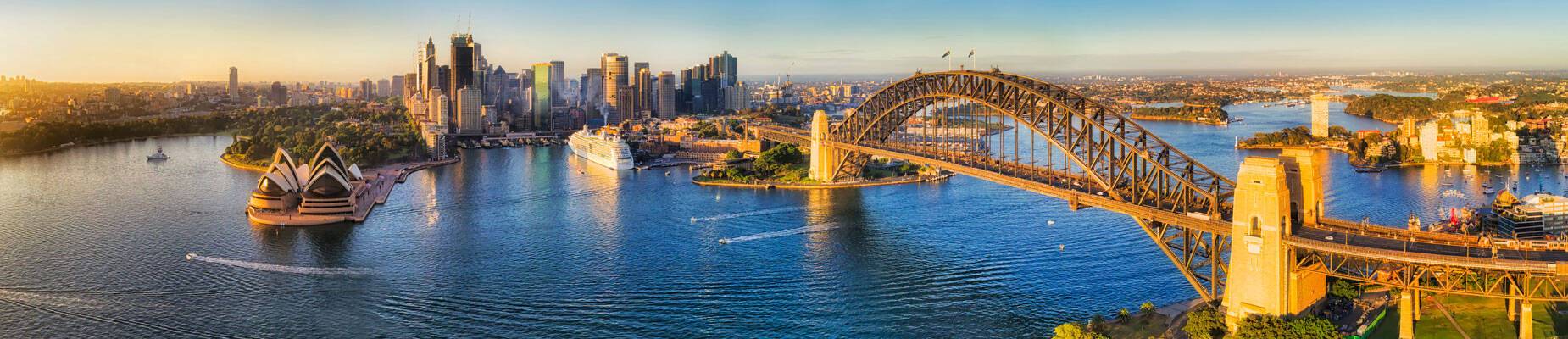 Panoramic image of Sydney Harbour Bridge at sunset in Sydney. Australia