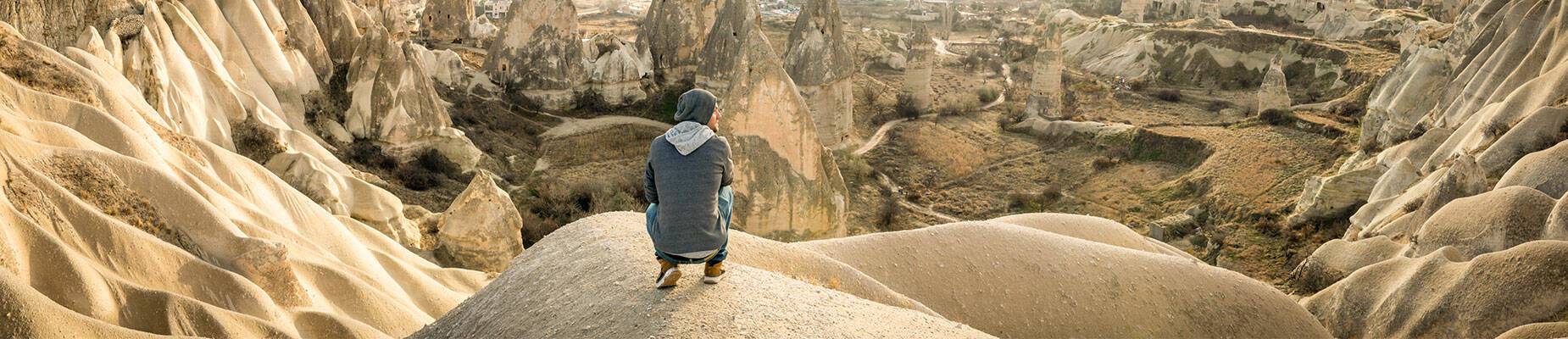 Solo traveller looking out over a landscape