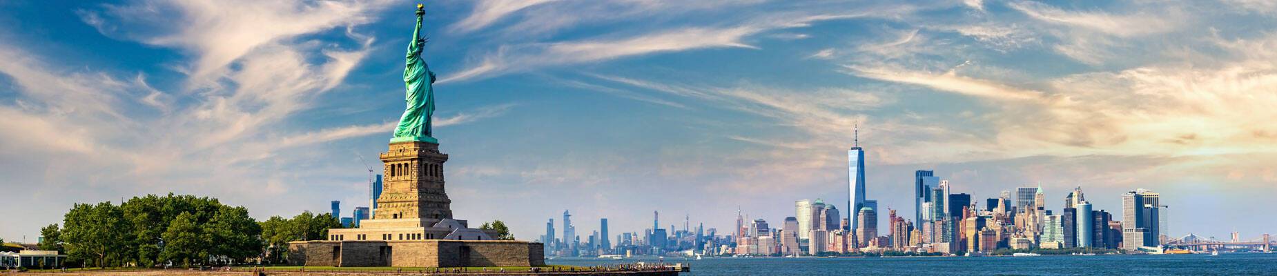 Panoramic image of New York skyline and the Statue of Liberty