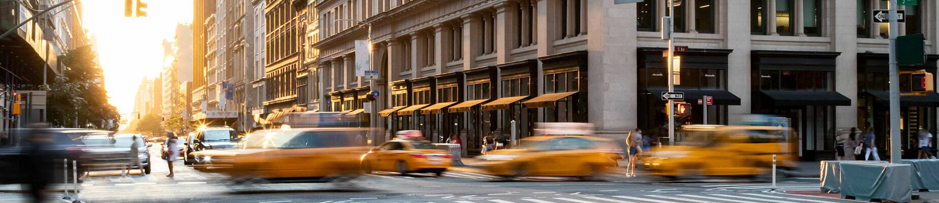 New York’s famous yellow taxis driving at speed