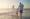 A family walking along the beach in the Mediterranean