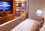 Royal Suite Bedroom in Celebrity Constellation