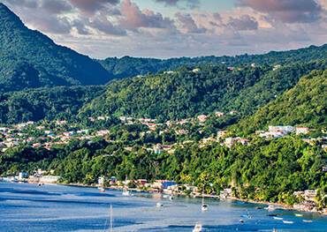 The blue waters and green hills of Dominica